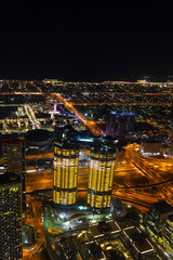 Aerial view of the illuminated night city.