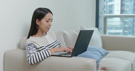 Poster - Woman watch on computer and sit on sofa