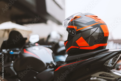 closeup helmet on bigbike with soft-focus and over light in the background