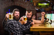 © be free - Alcohol drinks. Friends relaxing in pub with beer. Refreshing beer concept. Men drinking beer together. Hipster brutal man drinking beer with friend at bar counter. Men drunk relaxing having fun