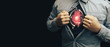 © Oleksandr - Business man in shirt with a picture neon red heart and atom. Innovative technologies.