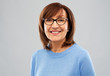© Syda Productions - vision and old people concept - portrait of smiling senior woman in glasses over grey background
