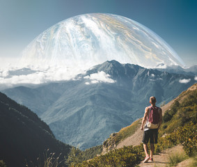 Wall Mural - traveling young man and huge planet in the sky b