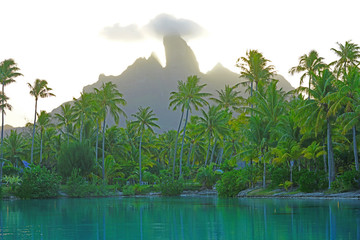 Wall Mural - View of the Mont Otemanu mountain reflecting in water at sunset in Bora Bora, French Polynesia, South Pacific