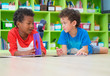 © weedezign - Two boy kid lay down on floor and reading tale book  in preschool library,Kindergarten school education concept.
