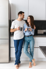 Wall Mural - beautiful young couple drinking coffee