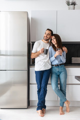 Wall Mural - beautiful young couple drinking coffee