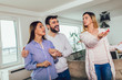 © Mediteraneo - Real Estate agent shows interior to young couple
