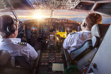 Pilots In The Cockpit During A Flight With Commercial Airplane.