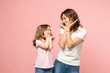© ViDi Studio - Woman in light clothes have fun with cute child baby girl. Mother, little kid daughter isolated on pastel pink wall background, studio portrait. Mother's Day, love family, parenthood childhood concept