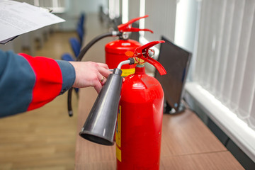 Wall Mural - engineer checking industrial fire control system,fire alarm controller, fire notifier. a fire exting