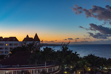 Wall Mural - beautiful sunset sky gradient behind a resort hotel on a warm evening