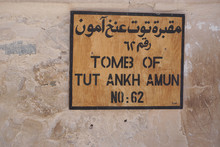 Luxor, Egypt: A Plain Wooden Sign In Arabic And English Indicates Tomb KV62, The Burial Place Of Pharaoh Tutankhamun, At The Valley Of The Kings.