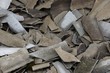 © butus - gray texture of broken pieces of slate in a pile of garbage
