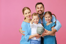 Financial Planning Happy Family Mother Father And Children With Piggy Bank On Pink .