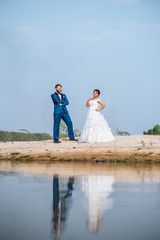 Asian bride and Caucasian groom have romance time and happy together