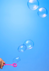 Poster - Soap bubbles on blue background
