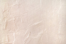 Rough Surface Plaster Texture. Peachy Pink Light Orange Color Background With Copy Space. Decorative Plastering Textured Wall. Abstract Backdrop.