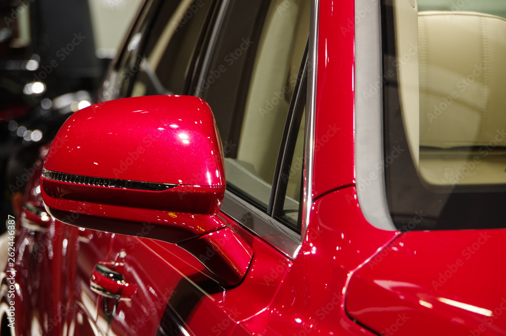 shiny red modern luxury SUV car side view mirror closeup Stock Photo ...