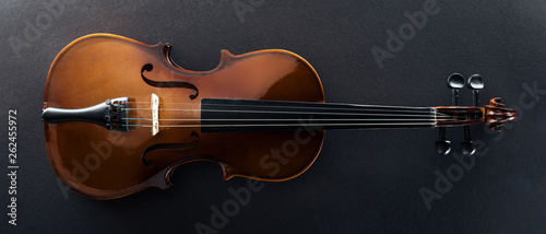 Fotografía top view of classical cello on black background