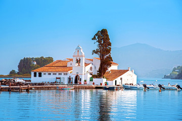 Wall Mural - nice optimistic bright view of vlacherna monastery on the kanoni peninsula in kerkyra, corfu, greece