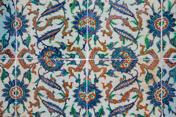 Texture of ceramic tiles in oriental East style. Turkish ceramic tiles lined on the wall. Old azulejo pattern floral ornament on floor. Ottoman traditional art. Moroccan portuguese mosaic background