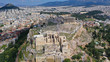 Aerial drone photo of iconic propylaia and the Parthenon in Acropolis hill, masterpiece of ancient world, Athens historic centre, Attica, Greece
