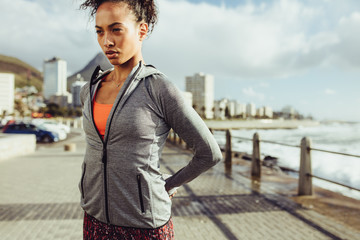 Wall Mural - Relaxing her muscles before a run