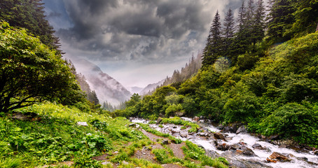 Canvas Print - Wonderful landscape with mountain river and sky. Rocky waterfall in the mountains.Balea waterfall in Fagaras mountains, Sibiu,Transylvania, Romania. near Transfagarasan road.