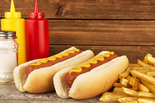 Duo Of Hot Dogs And French Fries On Table. Fast Food Restaurant Concept. Close Up. Copy Space For Your Text.