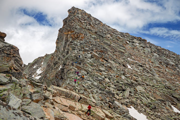 Wall Mural - some mountaineers climb the ridge of punta violetta, in the gran paradiso park, in italy.