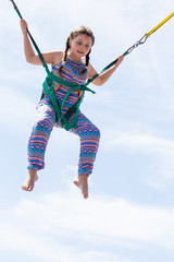 a young girl on the trampoline