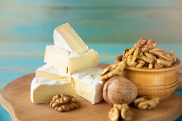 Cheese camembert or brie with walnut kernels