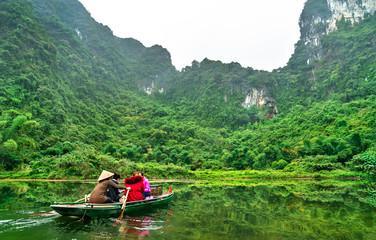 Canvas Print - Touristic rowboat at the Trang An Landscape Complex in Vietnam