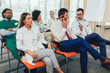 © Mediteraneo - Group of happy doctors on seminar in lecture hall at hospital