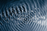 Fototapeta  - The texture of water under the influence of vibration in 258 hertz