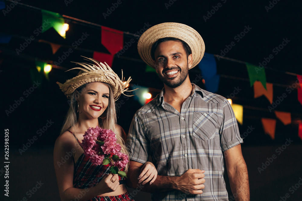 Brazilian couple wearing traditional clothes for Festa Junina - June