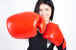 © suphaporn - beautiful Asian business young woman  Wearing a boxing glove in hand and business suit , Winning success business woman concept