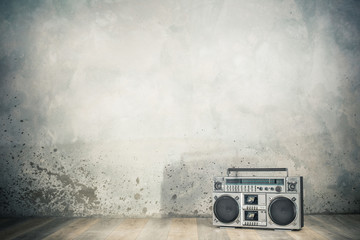 Wall Mural - retro outdated portable stereo boombox radio cassette recorder from 80s front concrete wall backgrou