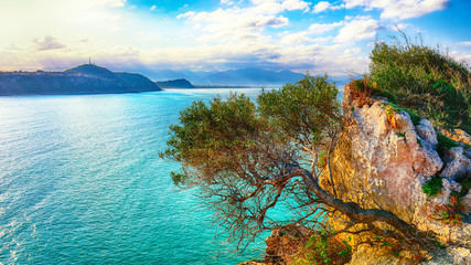 Dramatic spring sunset on the the cape Milazzo panorama of nature reserve Piscina di Venere.