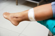 © Thachakrit - The doctor is making bandage wound on the legs of a woman.