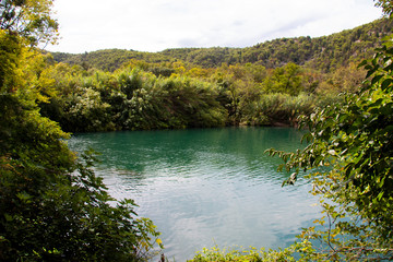 View from the cliff to the blue lake in the Croatian National Park Krk