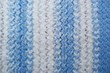 white and blue knitted fabric closeup background