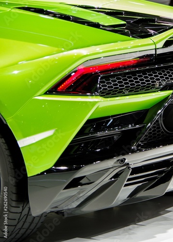 Fotomural Green shiny modern sports car body tail light and carbon fiber components