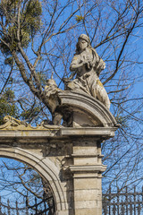 Wall Mural - Double parade gate with baroque pediment and figures of saints to Lviv Greek Catholic Archbishop's Cathedral of Saint George (Ukr: Sobor sviatoho Yura, 1760). Lviv, Ukraine.