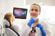 © gpointstudio - Portrait of female dentist preparing for the job