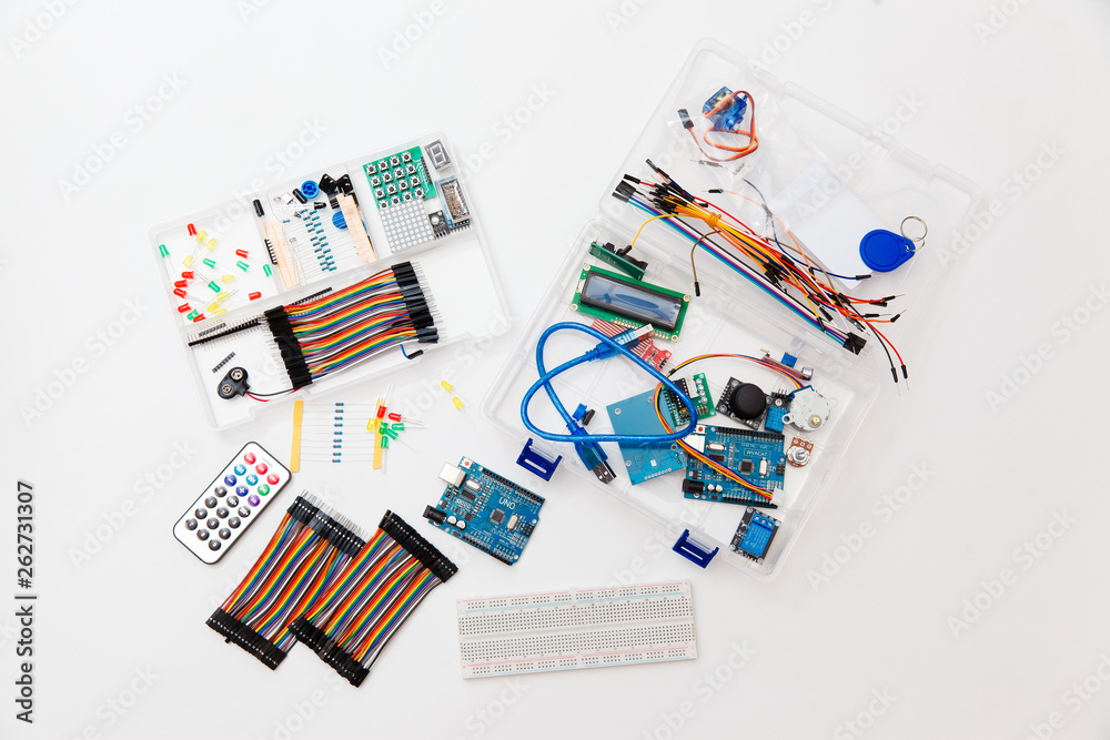 DIY arduino. Flat layout on white background, copy space. Electronic workshop components. 