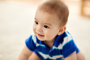 babyhood, childhood and people concept - close up of sweet little asian baby boy