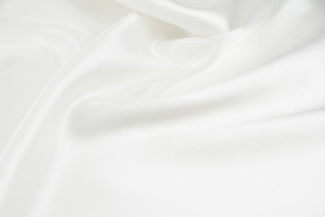 The texture of the satin fabric of white color for the background