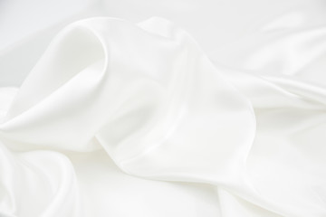 the texture of the satin fabric of white color for the background